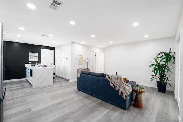 living room with light hardwood / wood-style floors