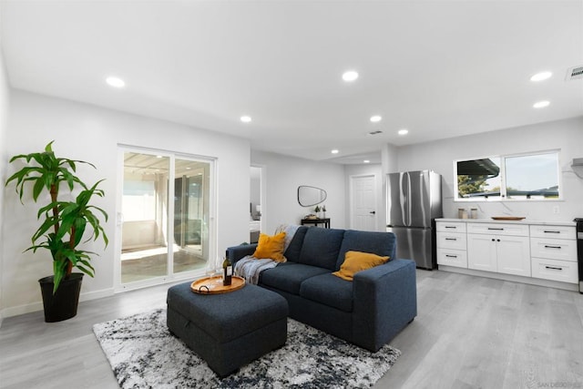 living room with light hardwood / wood-style flooring