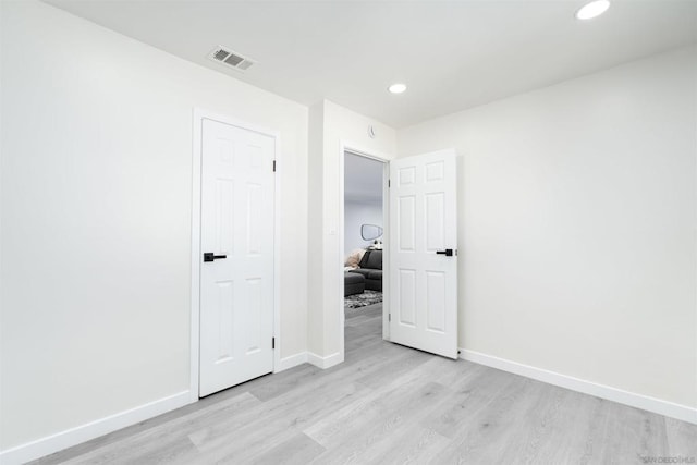 unfurnished room featuring light wood-type flooring