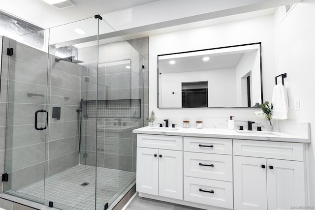 bathroom with vanity and walk in shower