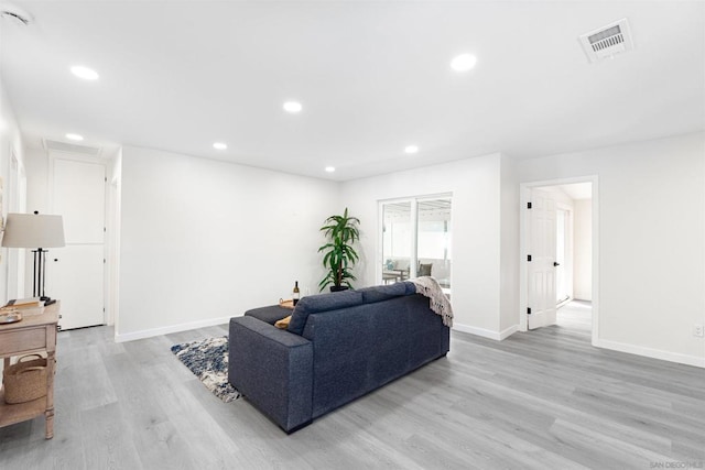 living room with light hardwood / wood-style floors