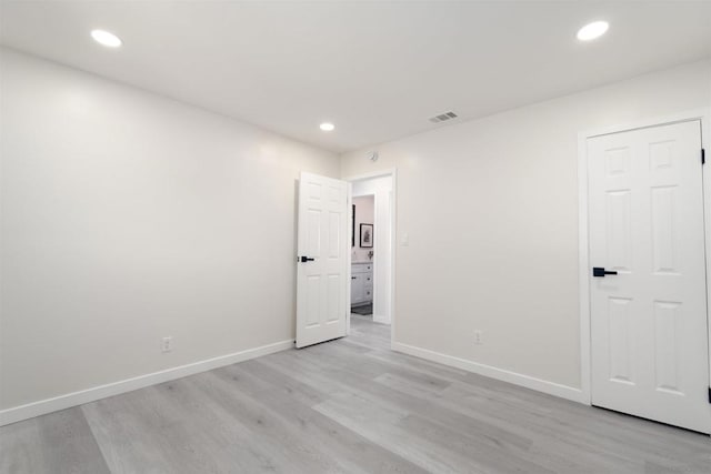 empty room with light wood-type flooring