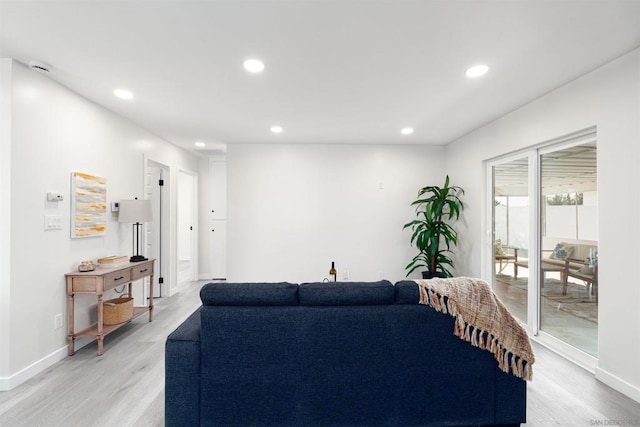 living room with light hardwood / wood-style flooring