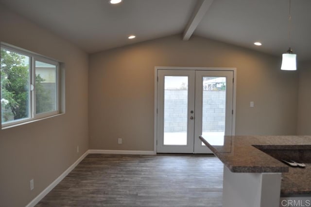 entryway featuring dark wood-type flooring, vaulted ceiling with beams, and french doors