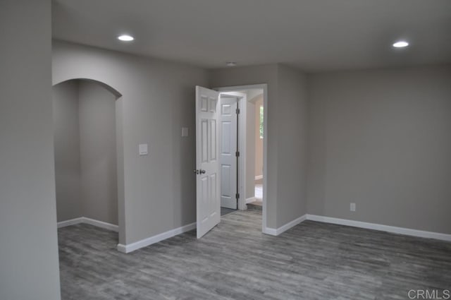 unfurnished room featuring wood-type flooring