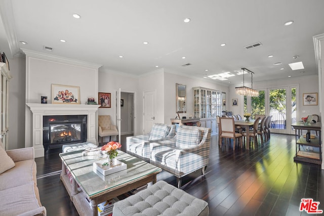 living room featuring crown molding and dark hardwood / wood-style flooring