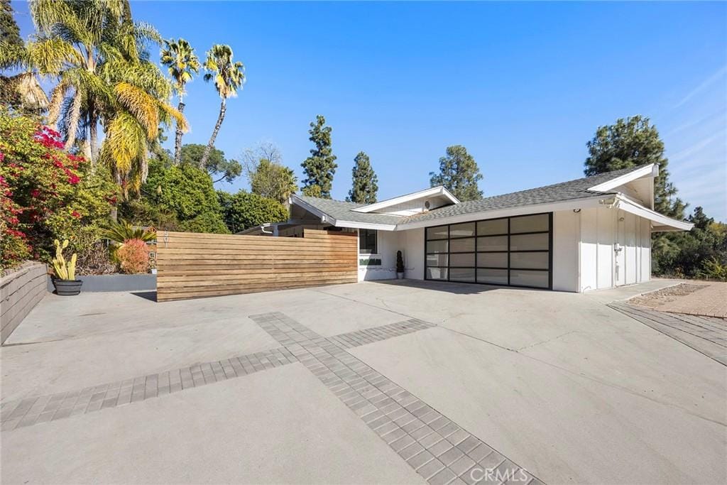 view of front of home with an attached garage and driveway