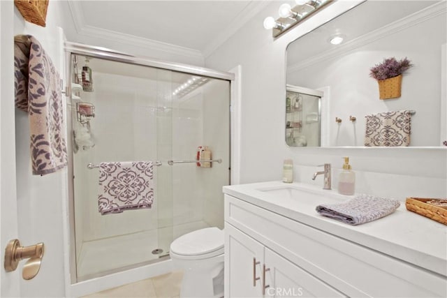 bathroom featuring ornamental molding, toilet, tile patterned flooring, and vanity