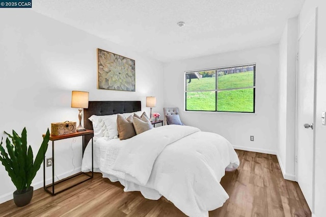 bedroom featuring hardwood / wood-style floors