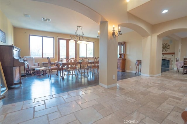 dining space with an inviting chandelier