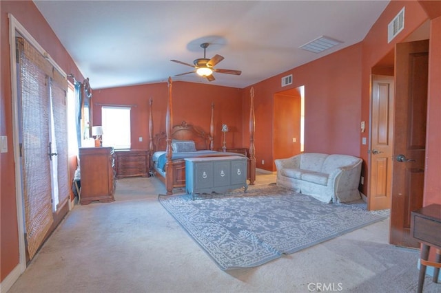 carpeted living room with vaulted ceiling and ceiling fan