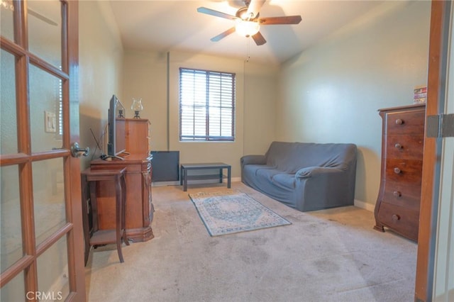 sitting room with light carpet and ceiling fan