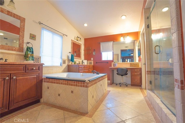 bathroom featuring lofted ceiling, plus walk in shower, vanity, and plenty of natural light