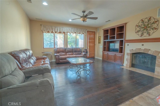 living room with dark hardwood / wood-style floors and ceiling fan