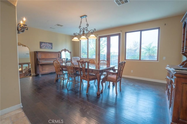 dining space featuring dark hardwood / wood-style flooring