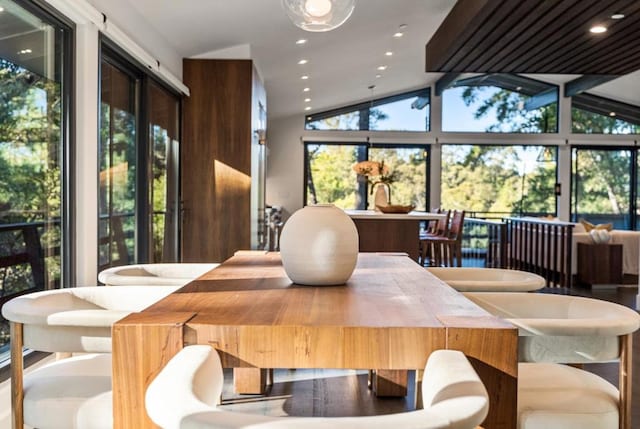 dining area featuring lofted ceiling