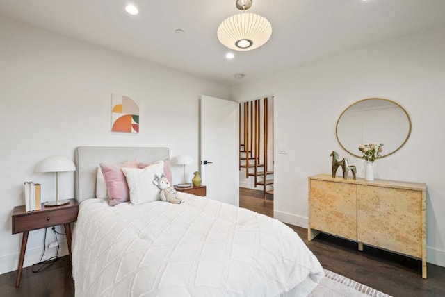 bedroom featuring dark hardwood / wood-style flooring