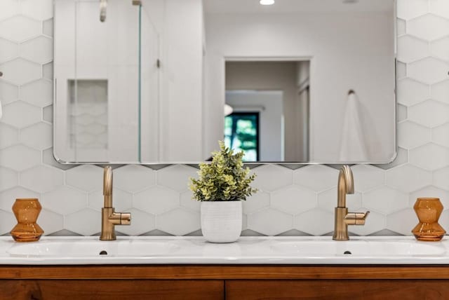 bathroom with sink and backsplash