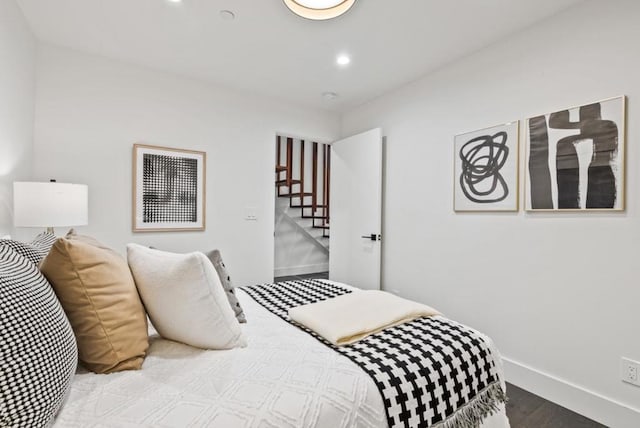 bedroom with hardwood / wood-style flooring