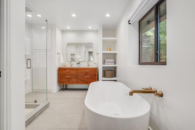 bathroom featuring vanity, separate shower and tub, tile patterned floors, and built in shelves