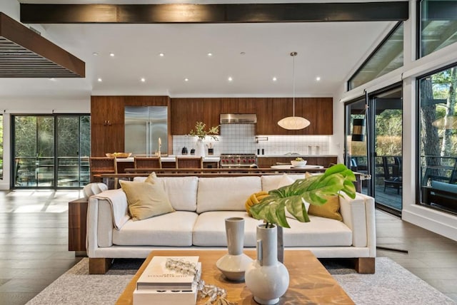 living room with lofted ceiling and hardwood / wood-style floors