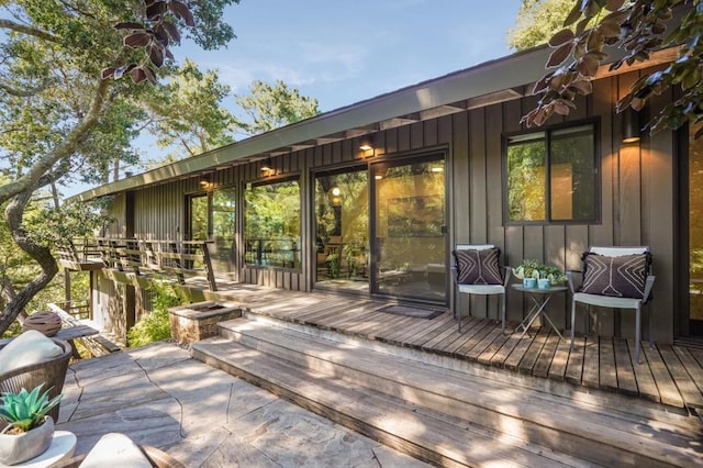 wooden deck with a fire pit