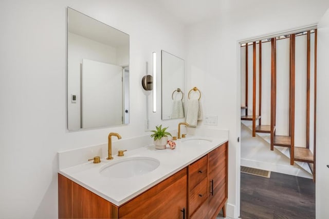 bathroom featuring vanity and hardwood / wood-style floors