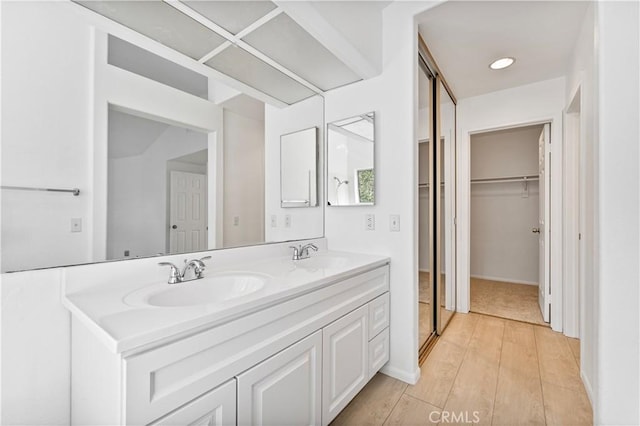 bathroom featuring hardwood / wood-style floors and vanity