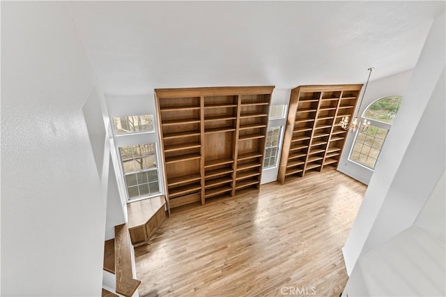 interior space featuring a notable chandelier and hardwood / wood-style floors