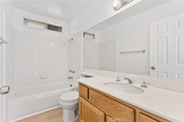 full bathroom featuring vanity, toilet, and shower / bath combination