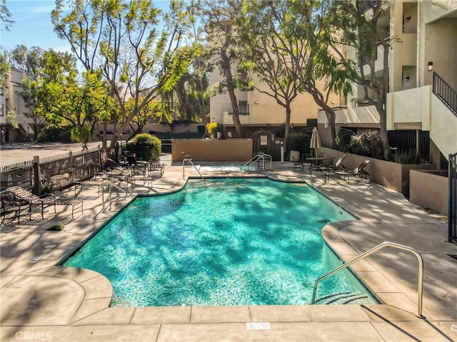 view of pool featuring a patio area