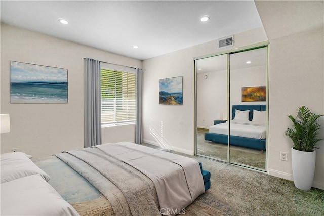 carpeted bedroom with a closet