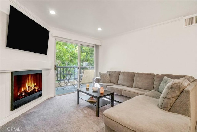 carpeted living room featuring crown molding