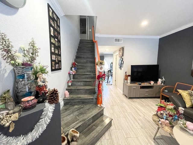 interior space featuring crown molding and light wood-type flooring