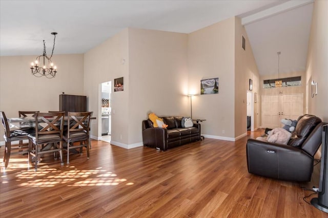 living room featuring hardwood / wood-style flooring and a chandelier