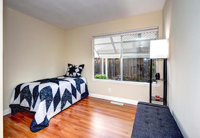 bedroom featuring wood-type flooring