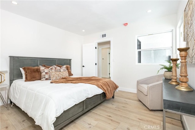 bedroom with light hardwood / wood-style floors