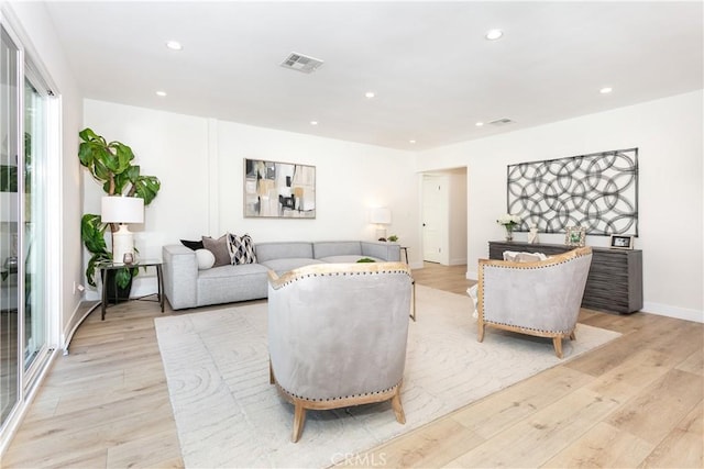 living room with light hardwood / wood-style flooring