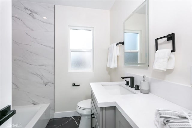 bathroom featuring vanity and toilet