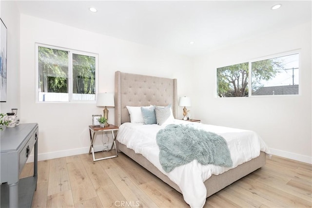 bedroom with light wood-type flooring