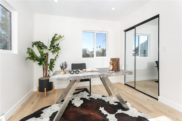 office with light hardwood / wood-style floors