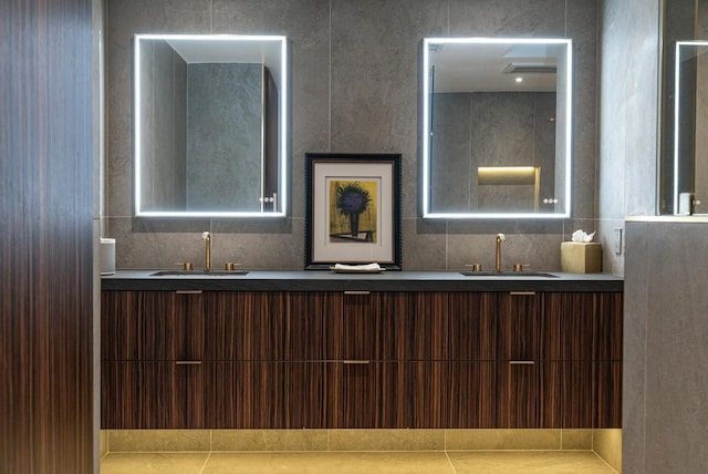 bathroom featuring tile patterned flooring and vanity