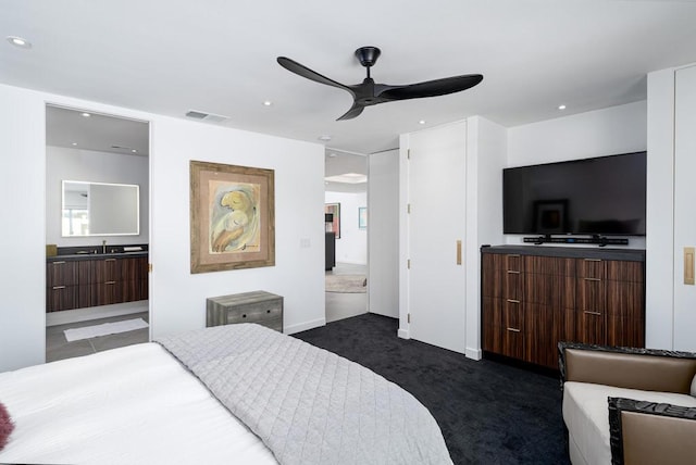 carpeted bedroom featuring ceiling fan, sink, and connected bathroom