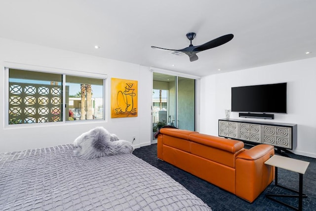 bedroom featuring ceiling fan and dark colored carpet