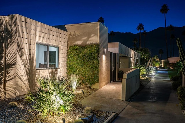 view of property exterior at twilight