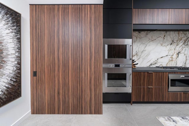 kitchen featuring stainless steel gas stovetop and light tile patterned floors