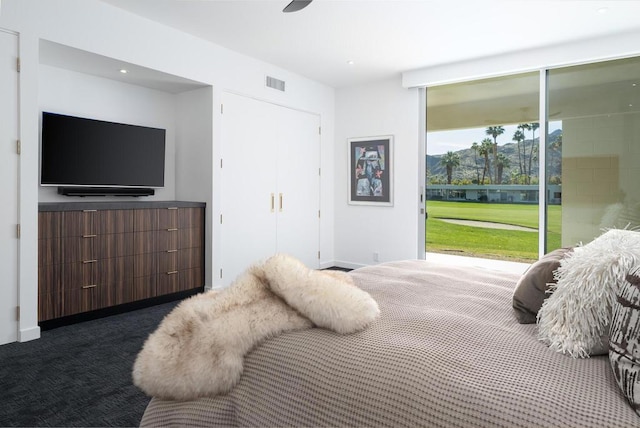 carpeted bedroom with ceiling fan and access to outside