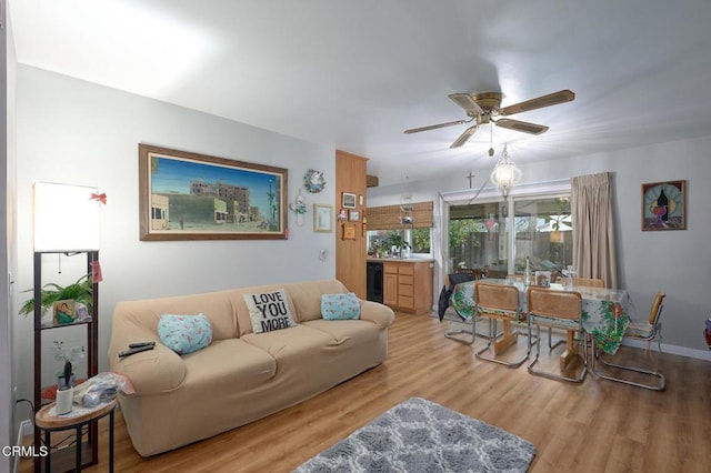 living room featuring wine cooler, light hardwood / wood-style flooring, and ceiling fan