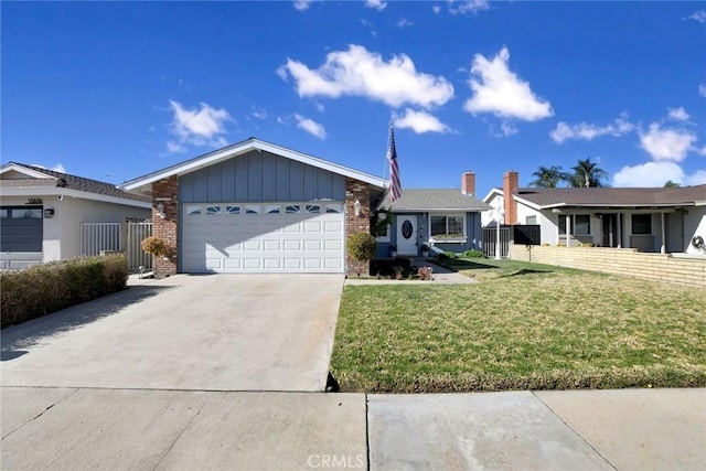 ranch-style home featuring a garage and a front lawn