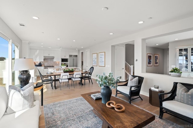 living room with light hardwood / wood-style flooring